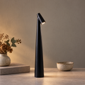 Tapered aluminium table lamp with angled spotlight head