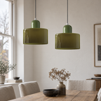 Pendant light with cylindrical glass shade in an original interior