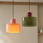 Pendant light with cylindrical glass shade in an original interior