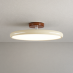 Beige ceiling light with tilting disc shade — photo 06