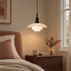 Pendant light with three layered opal glass shades and black fitting