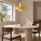 Yellow glass shade pendant light with ivory body, dining area