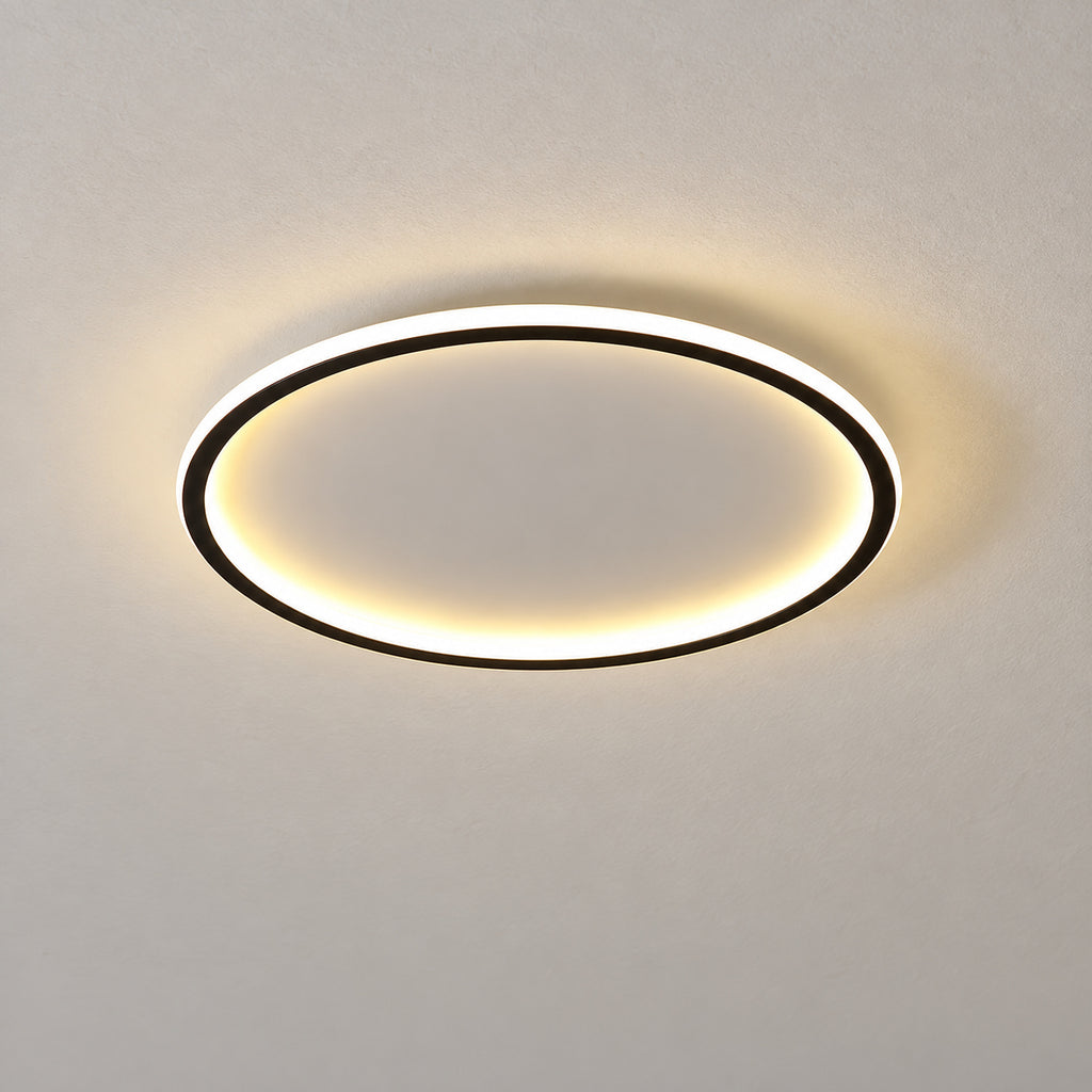 11 · Round flush ceiling light, black frame, warm-white light, product close-up