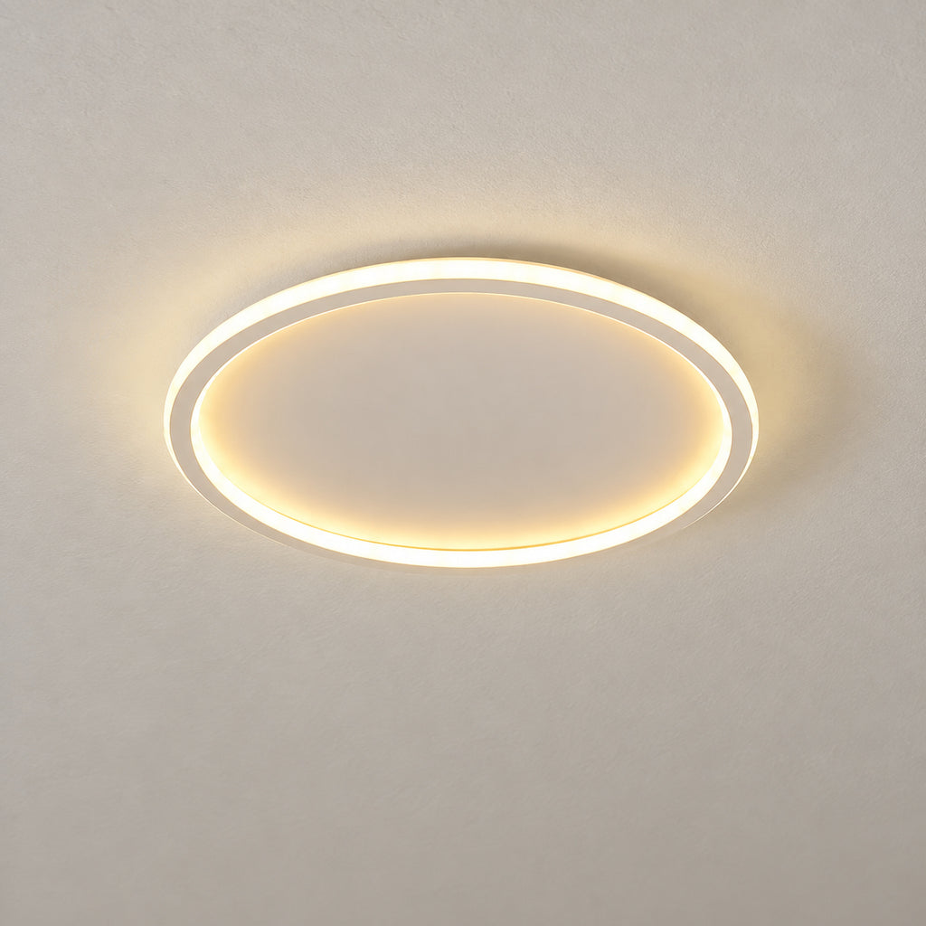 12 · Round flush ceiling light, white frame, warm-white light, product close-up