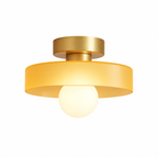 Gold/Orange semi flush ceiling light with a round glass shade