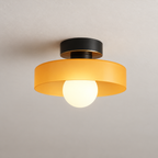 Semi flush ceiling light with black fitting and orange glass shade