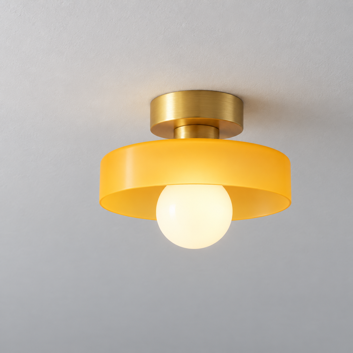 Semi flush ceiling light with gold fitting and orange glass shade