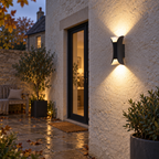 Black wall light with curved metal body