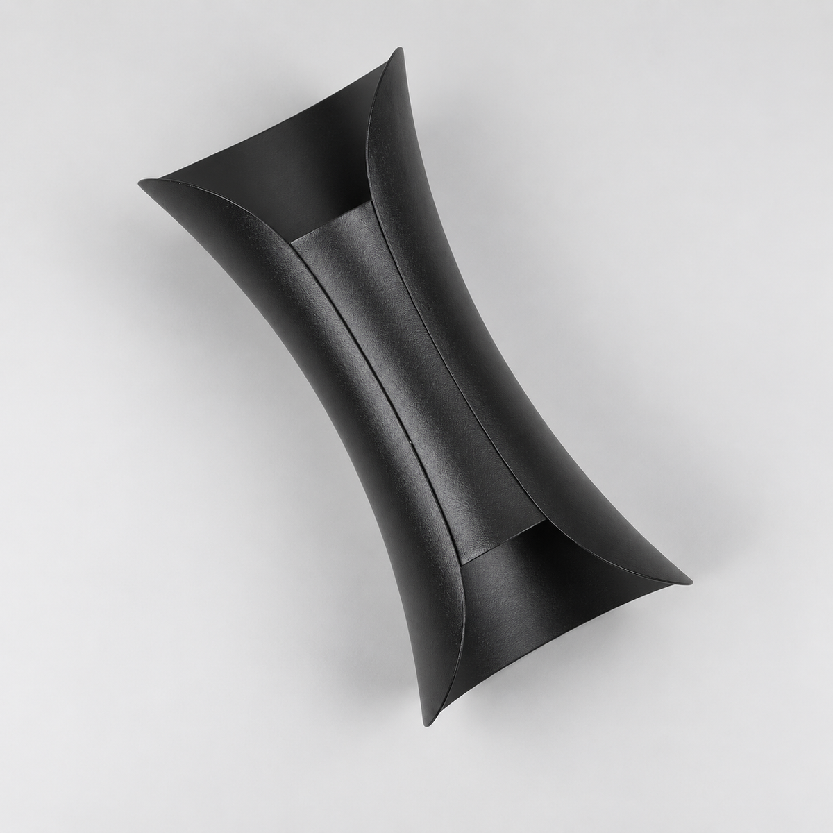 Black wall light with curved metal body